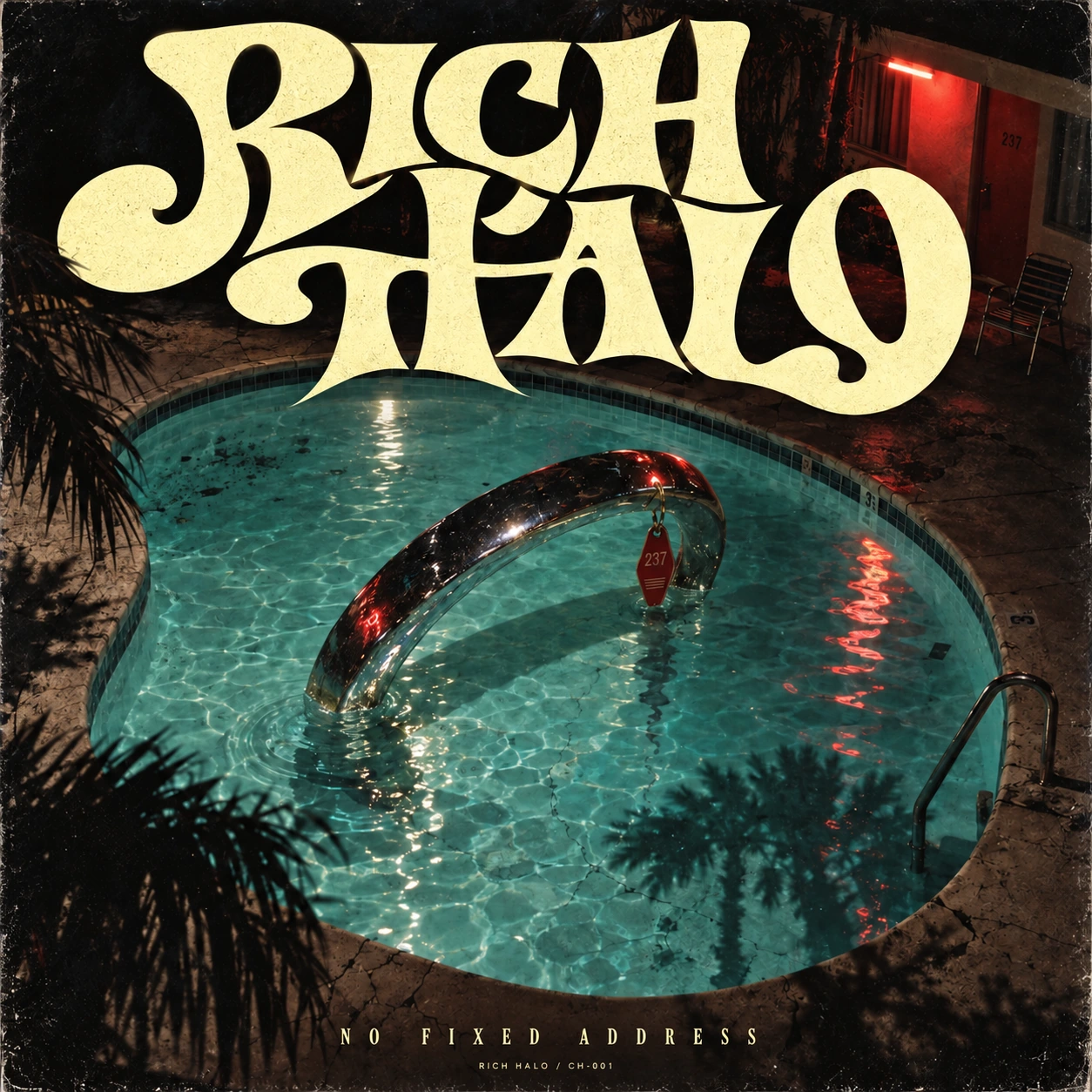 Rich Halo — No Fixed Address album with sculptural lettering and a chrome halo in a midnight pool